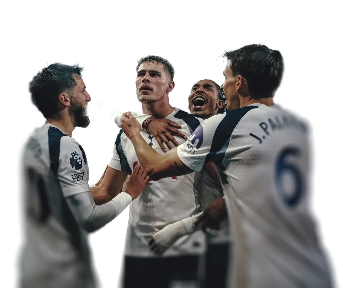 Four Tottenham players celebrating joyfully together in white jerseys during a match